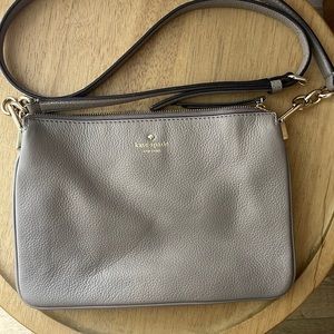 Color is like a purple grey. With gold accents